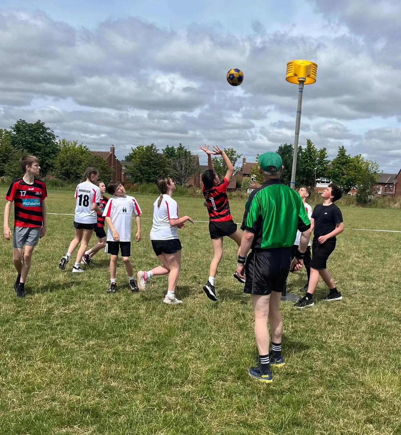 Children learning korfball skills together
