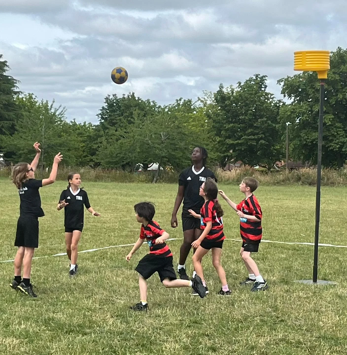 Young korfball players taking part in a match